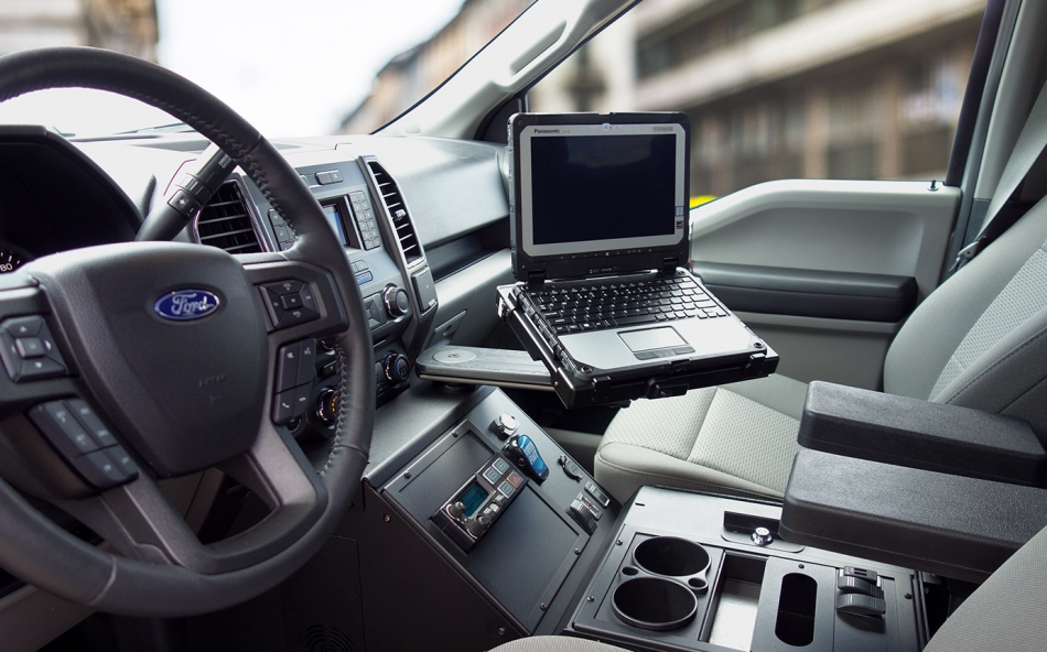 Panasonic Toughbook 20 laptop docking station mounted on Mongoose motion attachment in Ford Utility Police Interceptor