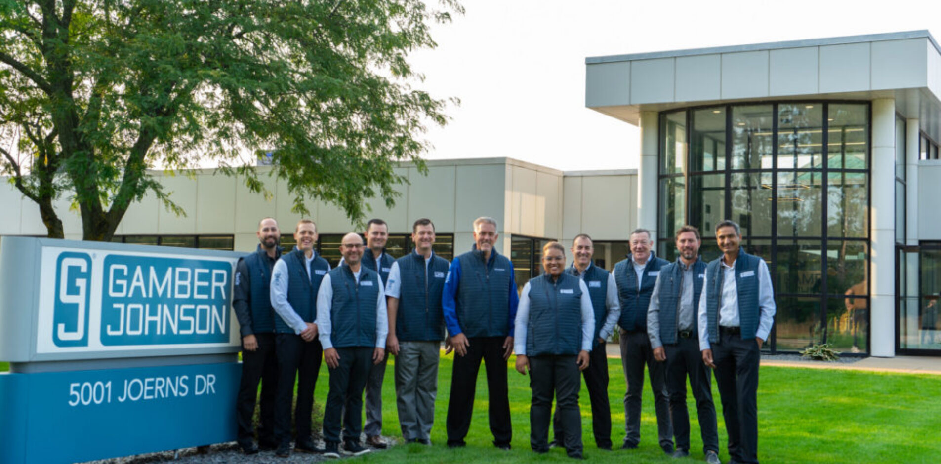 Executive Team for Team Gamber-Johnson standing outside GJ HQ