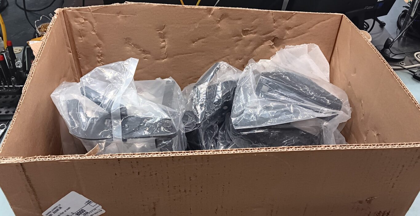 items in a broken box with incorrect packaging