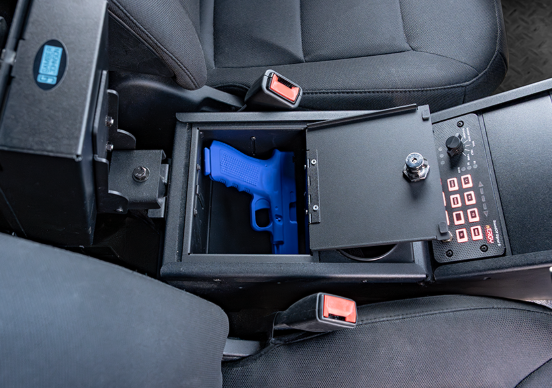 Adjustable Depth Locking Console Storage Pocket in a Ford PIU with a Glock 17 secured.