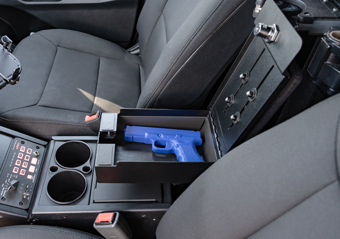 Breakaway Armrest Lockbox installed in a ford PIU holding a fake glock