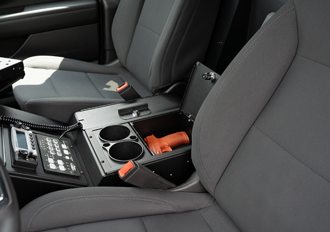 An open 7-inch Locking Storage Pocket with a fake glock